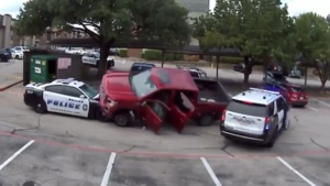Police Chase ends with Suspect Trapped under Car.
