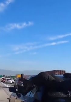 Biker crashes into a car